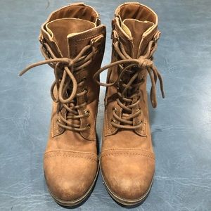 Distressed tan leather heeled combat boots